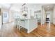 Bright, airy kitchen featuring a large island, stainless steel appliances, and hardwood floors at 1550 Masters Club Dr, Sandy Springs, GA 30350