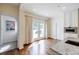 Bright kitchen space with hardwood floors and marble countertops leads to a cozy outdoor patio at 1550 Masters Club Dr, Sandy Springs, GA 30350