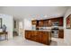 Basement kitchenette features stainless steel appliances, wooden cabinets, and granite countertops at 1550 Masters Club Dr, Sandy Springs, GA 30350