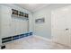 Stylish mud room features built-in cubbies, ample storage, and sleek tile flooring at 1550 Masters Club Dr, Sandy Springs, GA 30350