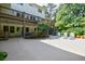 Spacious patio with outdoor seating and beautifully landscaped surroundings provides ample relaxation space at 1550 Masters Club Dr, Sandy Springs, GA 30350