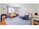 Cozy sitting room with hardwood floors, area rug, and natural light at 1550 Masters Club Dr, Sandy Springs, GA 30350