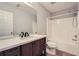 Bathroom features a large mirror and shower and tub combination at 1963 Lakeshore Overlook Nw Cir, Kennesaw, GA 30152