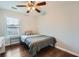 Bedroom features wood-look floors, ceiling fan, and window at 1963 Lakeshore Overlook Nw Cir, Kennesaw, GA 30152