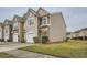 Traditional home featuring a manicured lawn, attached garage and neutral color palette at 1963 Lakeshore Overlook Nw Cir, Kennesaw, GA 30152