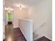 View of upstairs hallway leading to bedrooms and stairs at 1963 Lakeshore Overlook Nw Cir, Kennesaw, GA 30152