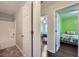 Hallway showcasing entry into a bedroom and bathroom at 1963 Lakeshore Overlook Nw Cir, Kennesaw, GA 30152