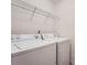 Laundry room area with white washer and dryer at 1963 Lakeshore Overlook Nw Cir, Kennesaw, GA 30152