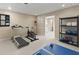Home gym with equipment including treadmill, stationary bike, weights, and workout mat at 2871 Liberty Ct, Marietta, GA 30066