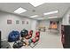 Finished basement with gaming setup, including chairs, steering wheel, and foosball table at 2871 Liberty Ct, Marietta, GA 30066