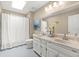Bright bathroom featuring a double vanity, modern lighting, and a shower-tub combination at 2871 Liberty Ct, Marietta, GA 30066