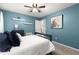 Bedroom with ceiling fan, soft carpet, neutral walls and ceiling, and comfy bed at 2871 Liberty Ct, Marietta, GA 30066