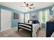 Comfortable bedroom featuring a ceiling fan, a large window, and light blue walls at 2871 Liberty Ct, Marietta, GA 30066