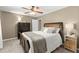 Well lit bedroom showcasing a large bed, ceiling fan, carpet, and decor at 2871 Liberty Ct, Marietta, GA 30066