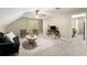 Bonus room featuring a sitting area, a ceiling fan, neutral colors, and plenty of natural light at 2871 Liberty Ct, Marietta, GA 30066