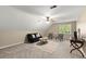 Bonus room featuring a sitting area, a ceiling fan, neutral colors, and plenty of natural light at 2871 Liberty Ct, Marietta, GA 30066