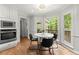 Bright breakfast nook features large windows, a modern light fixture, and views of the backyard at 2871 Liberty Ct, Marietta, GA 30066