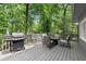 Outdoor deck features a grill, fire pit and cushioned chairs for entertaining at 2871 Liberty Ct, Marietta, GA 30066