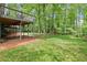 Spacious wooden deck overlooking a lush, wooded backyard at 2871 Liberty Ct, Marietta, GA 30066