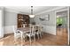 Elegant dining room featuring wainscoting, hardwood floors, and a classic china cabinet at 2871 Liberty Ct, Marietta, GA 30066