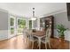 Bright dining room with bay window, hardwood floors, and classic wainscotting at 2871 Liberty Ct, Marietta, GA 30066