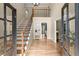 Elegant foyer with hardwood floors, staircase, and access to the living room at 2871 Liberty Ct, Marietta, GA 30066