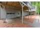 Spacious patio area and garage access beneath the home's wooden deck at 2871 Liberty Ct, Marietta, GA 30066