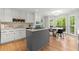 Well-lit kitchen with center island cooktop, white cabinetry, and breakfast nook at 2871 Liberty Ct, Marietta, GA 30066