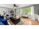 Comfortable living room with hardwood floors, a neutral color palette, and large windows with wooded views at 2871 Liberty Ct, Marietta, GA 30066