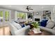Cozy living room with a fireplace, built-in shelving, and access to the outdoor deck at 2871 Liberty Ct, Marietta, GA 30066