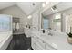 Bright bathroom with double sink vanity, soaking tub, walk-in closet access, and skylight at 2871 Liberty Ct, Marietta, GA 30066