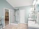 Bathroom featuring double vanity, glass shower, tile floor, and natural lighting at 510 Rosedown Way, Alpharetta, GA 30022