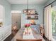Stylish dining room featuring wood floors and elegant light fixture, perfect for entertaining at 510 Rosedown Way, Alpharetta, GA 30022
