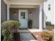 Inviting entrance with a light blue front door, white pillars, and beautifully landscaped surroundings at 510 Rosedown Way, Alpharetta, GA 30022