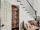 Hallway features a wooden bench, a staircase, and a unique storage cabinet for added convenience at 510 Rosedown Way, Alpharetta, GA 30022