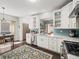 Beautiful kitchen featuring white cabinets, stainless steel appliances, and open layout at 510 Rosedown Way, Alpharetta, GA 30022