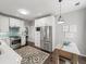 Modern kitchen with stainless steel appliances, white cabinets, and stylish backsplash at 510 Rosedown Way, Alpharetta, GA 30022