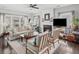 Bright living room with hardwood floors, fireplace, and large windows offering a cozy and inviting atmosphere at 510 Rosedown Way, Alpharetta, GA 30022