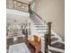 Open-concept living room with a staircase and hardwood floors that offers a seamless flow and ample space at 510 Rosedown Way, Alpharetta, GA 30022