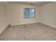 A sun-filled bedroom features neutral carpet and a large closet at 6 Holly Downs Nw Ct, Atlanta, GA 30318