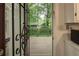 View from the kitchen door, looking out to the private back deck at 6 Holly Downs Nw Ct, Atlanta, GA 30318