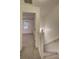 Upstairs hallway featuring access to the bedroom and a staircase at 6 Holly Downs Nw Ct, Atlanta, GA 30318