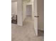 Hallway leading to different rooms, showing neutral carpet and white walls at 6 Holly Downs Nw Ct, Atlanta, GA 30318