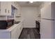 Classic kitchen featuring white appliances and ample cabinet space at 6 Holly Downs Nw Ct, Atlanta, GA 30318