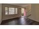 Bright living room with stylish flooring and natural light from a window at 6 Holly Downs Nw Ct, Atlanta, GA 30318