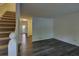 Open living area with modern flooring and staircase, creating a welcoming space at 6 Holly Downs Nw Ct, Atlanta, GA 30318