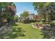 Expansive backyard featuring a deck, fire pit, playset, and lush lawn for outdoor enjoyment at 6640 Stratford Pl, Cumming, GA 30040