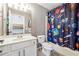 This ' bathroom features a shower/tub combo with space themed shower curtain at 6640 Stratford Pl, Cumming, GA 30040
