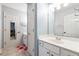 Bright bathroom with tile floors, white cabinets, and stylish fixtures, offering a clean, modern feel at 6640 Stratford Pl, Cumming, GA 30040
