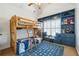 Charming bedroom with bunk beds, window seat, and custom built-ins at 6640 Stratford Pl, Cumming, GA 30040